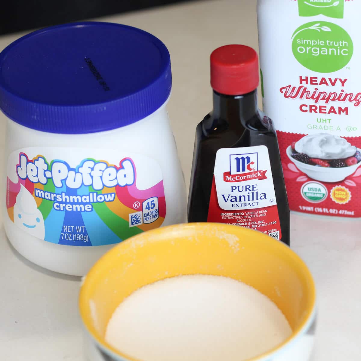 Ingredients for marshmallow whipped cream frosting.